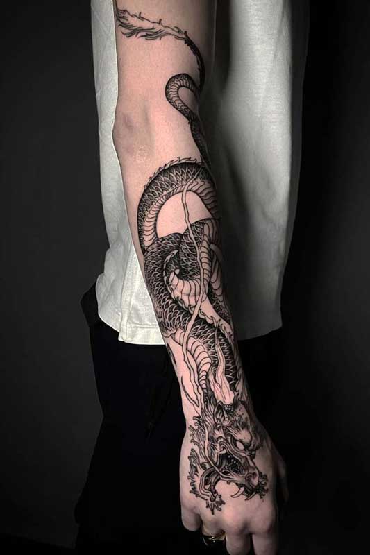 Dragon on a mans arm